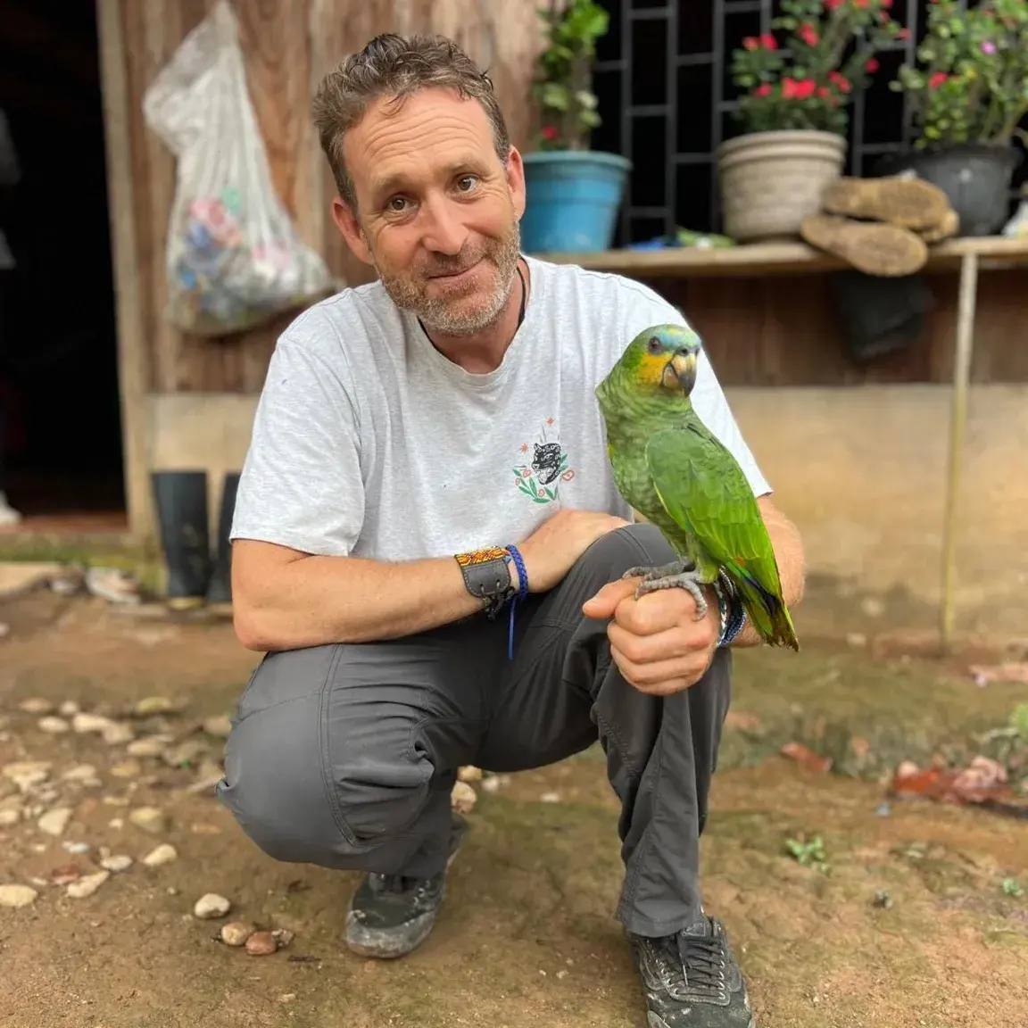 Iowaska retreat in Colombia with parrot and retreat guide at Camino al Sol